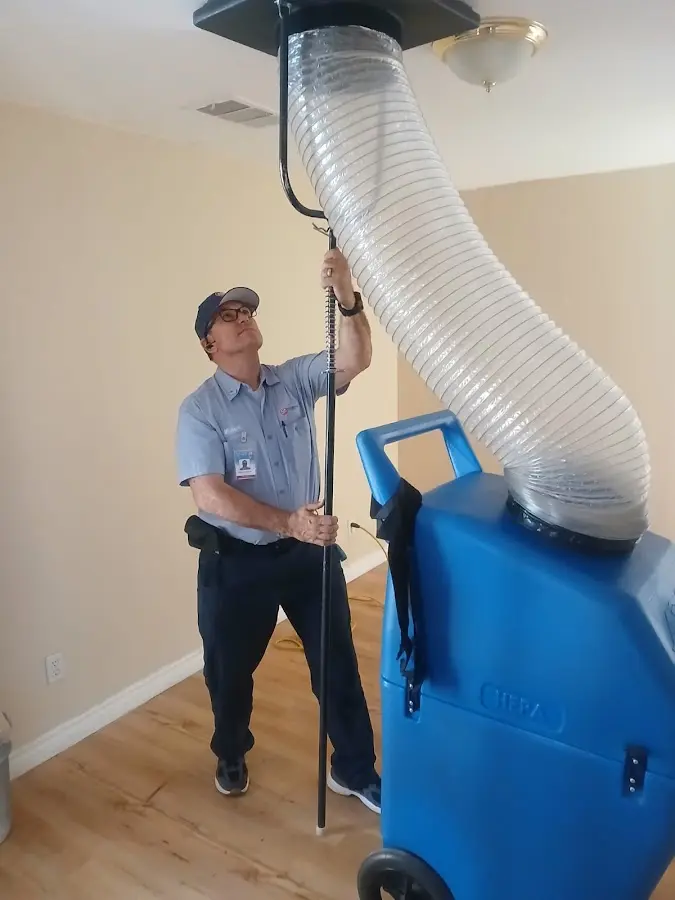 Mini Split Installation technician using HEPA equipment in Ash